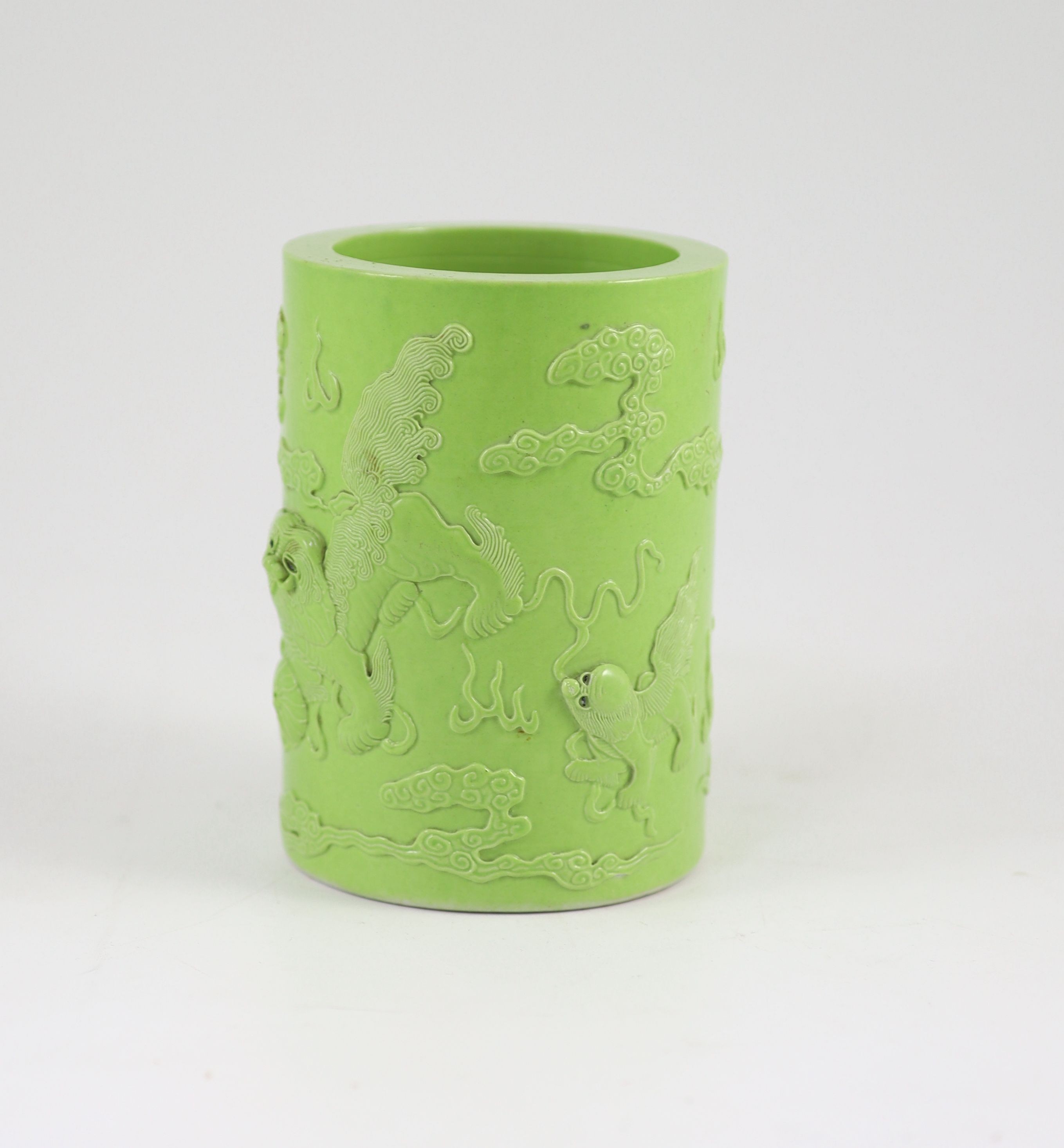 A Chinese lime green glazed brushpot, 19th century, 13.6 cm high, small splinter chip to inner rim